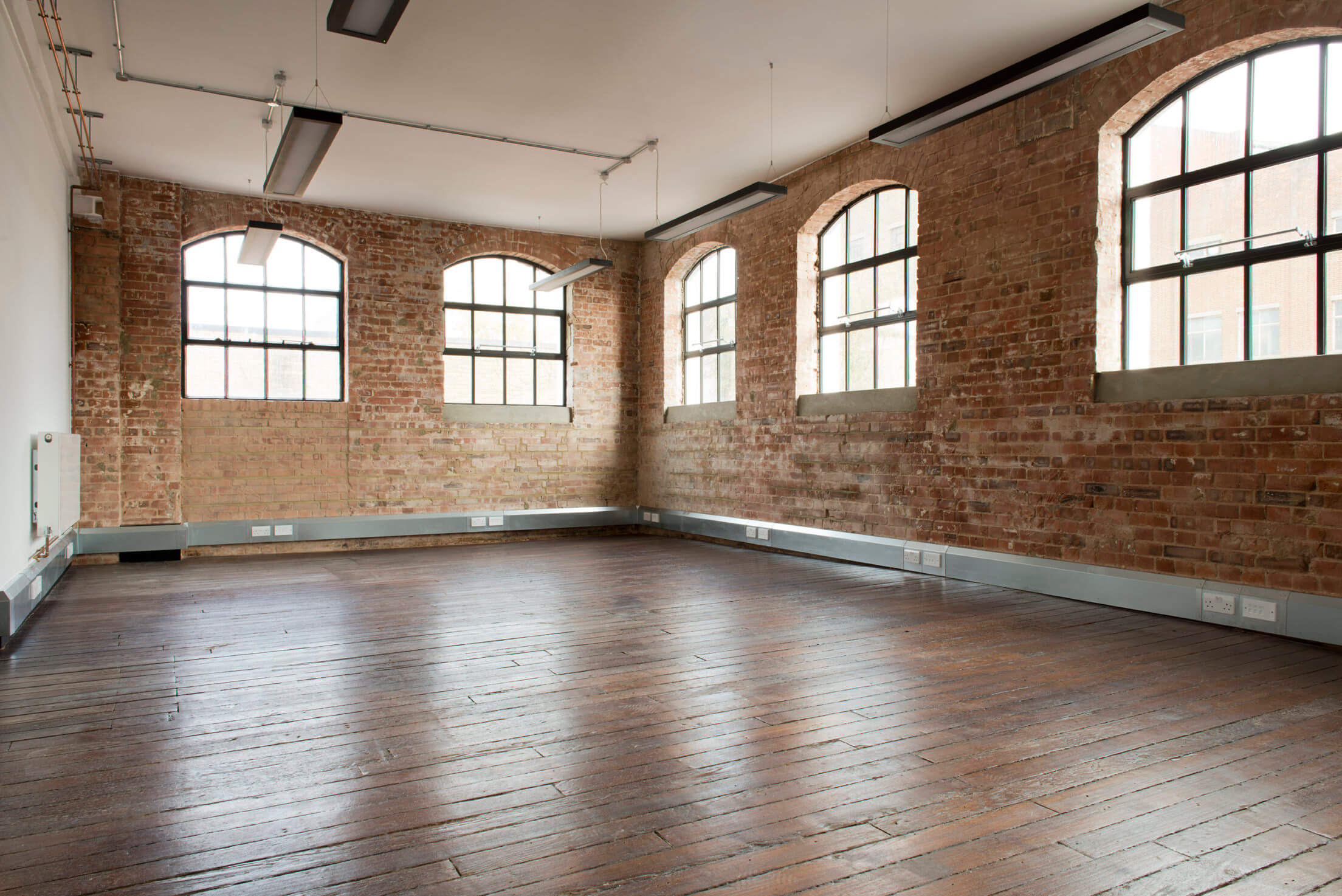 chocolate factory empty bricked room and wooden floors