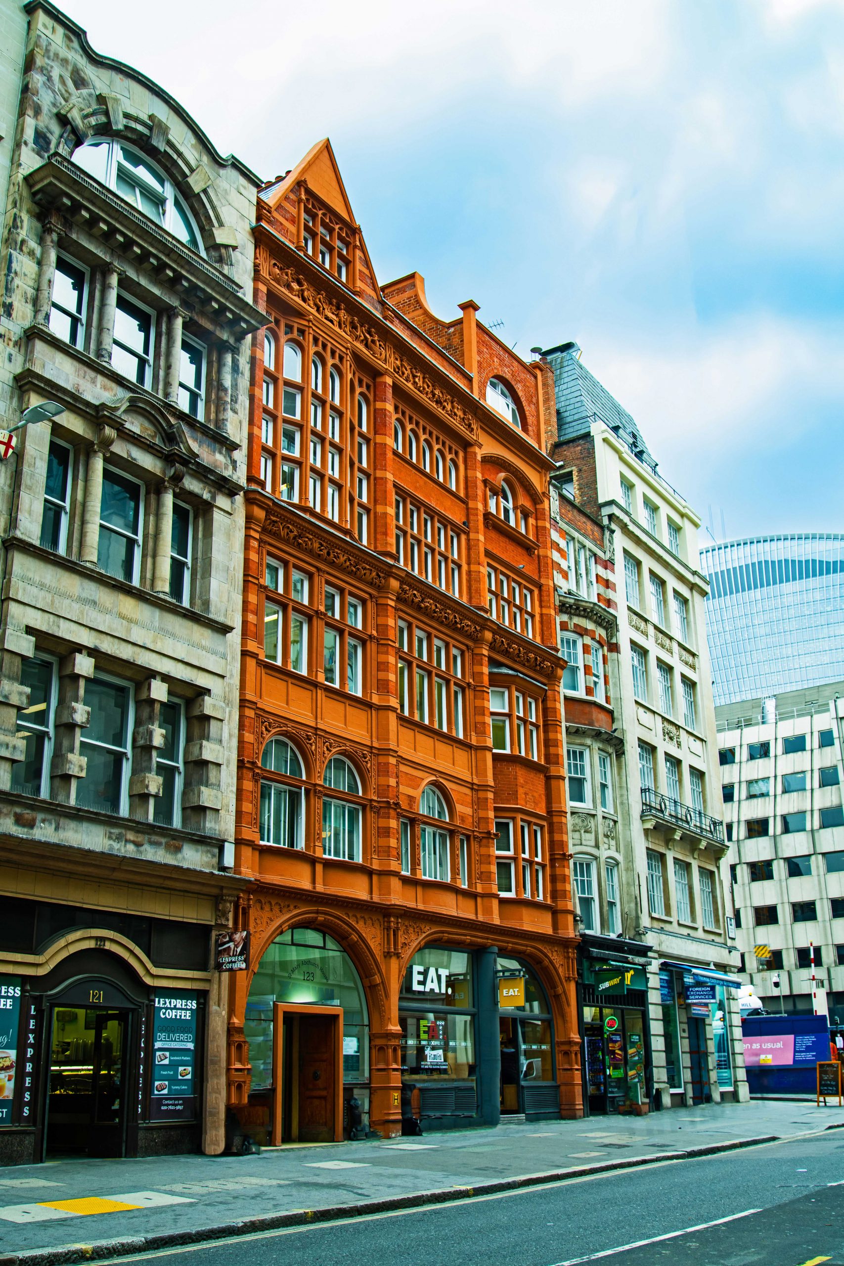 dirty white, tangerine, and white buildings